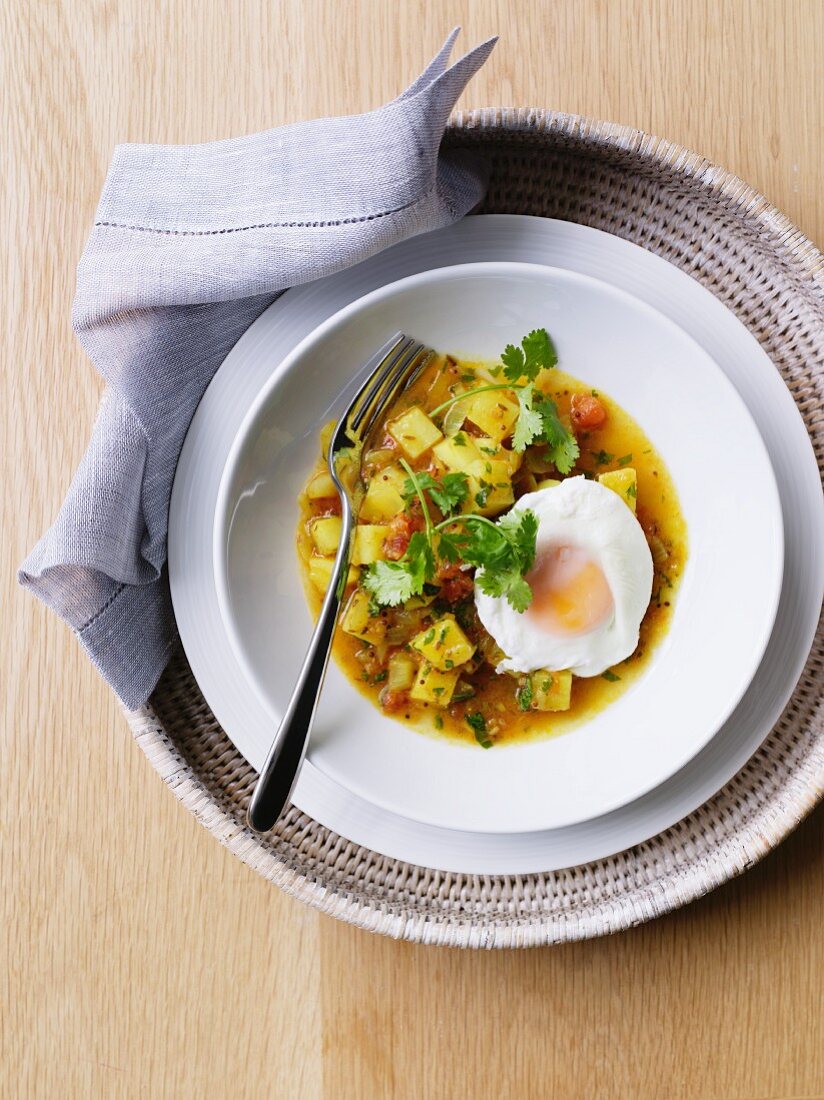 Potato curry with a fried egg