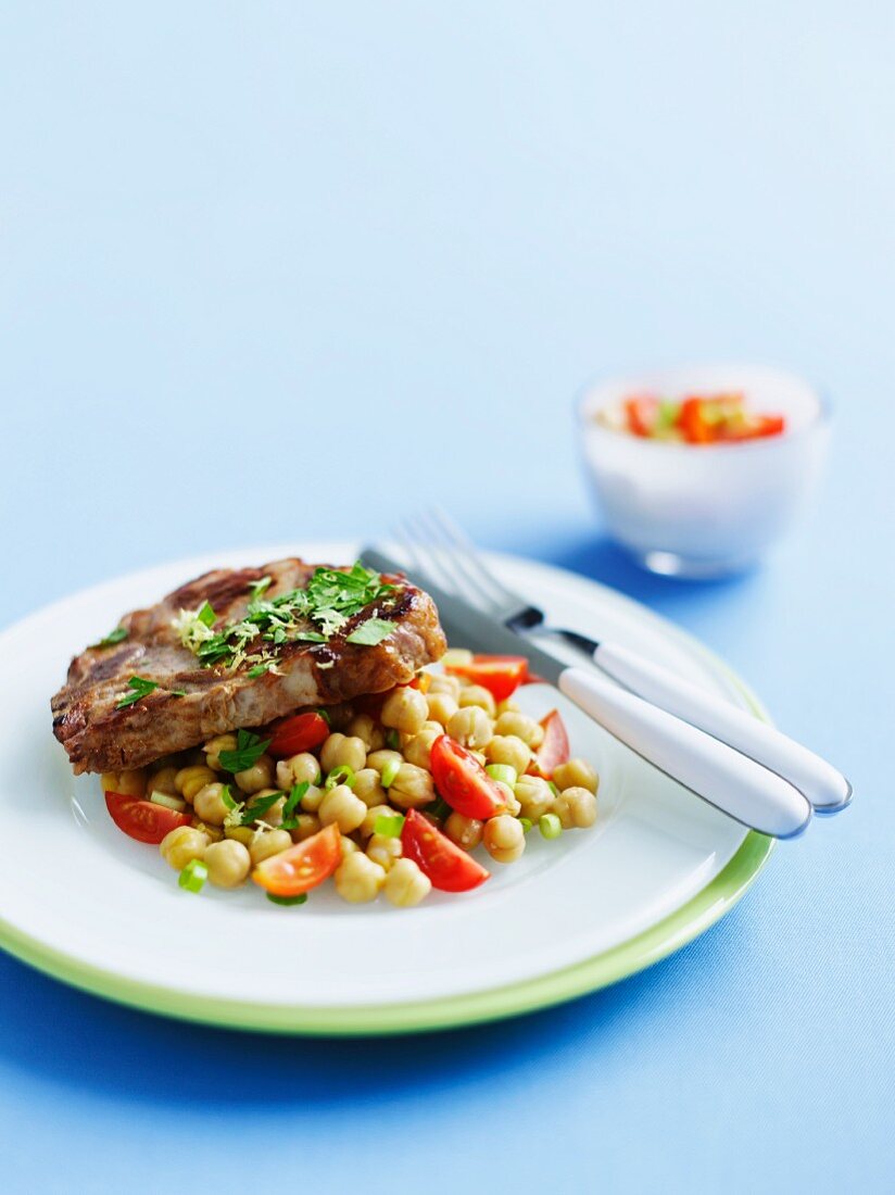 Veal chop with a chickpea salad