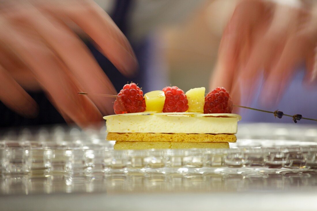 A cream slice and a fruit kebab