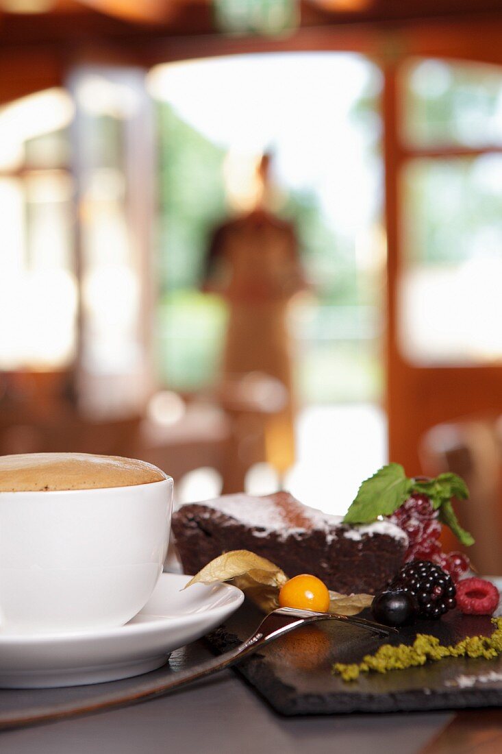 Chocolate cake, fruit and coffee