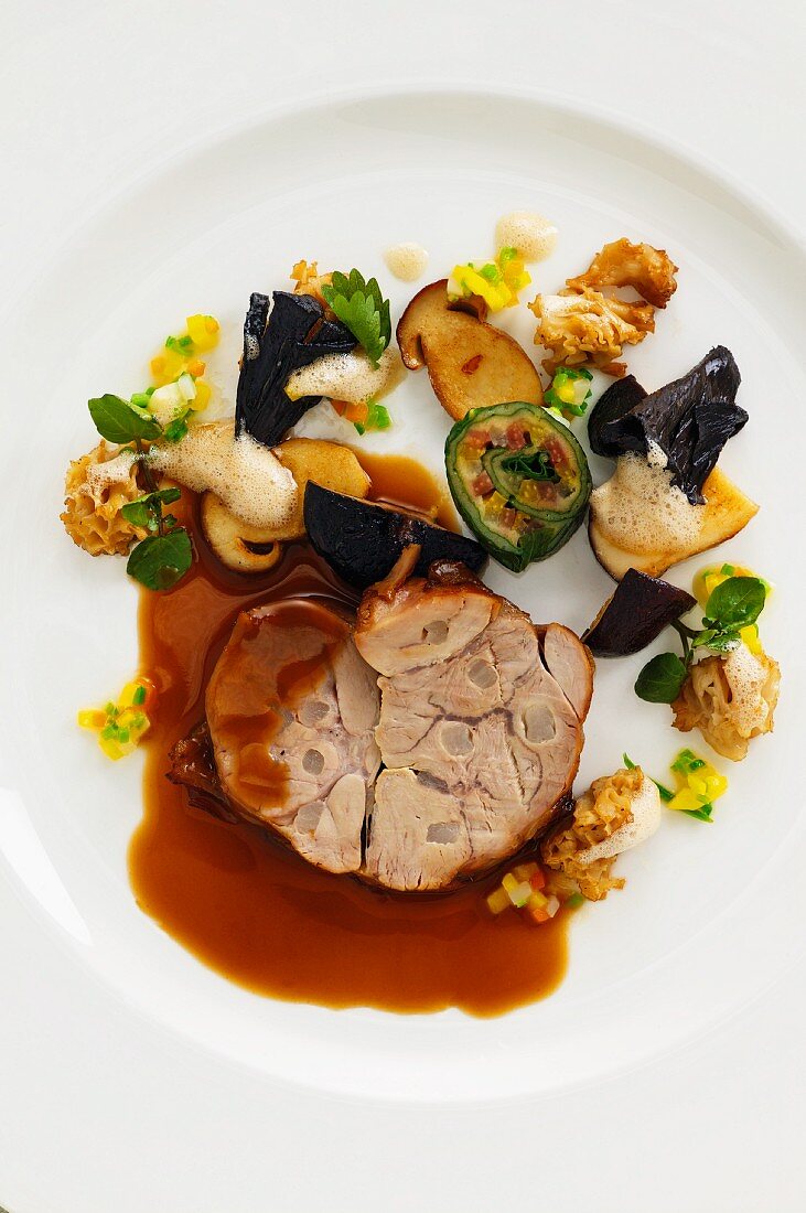 Glazed veal roulade with mushrooms and chard roulade