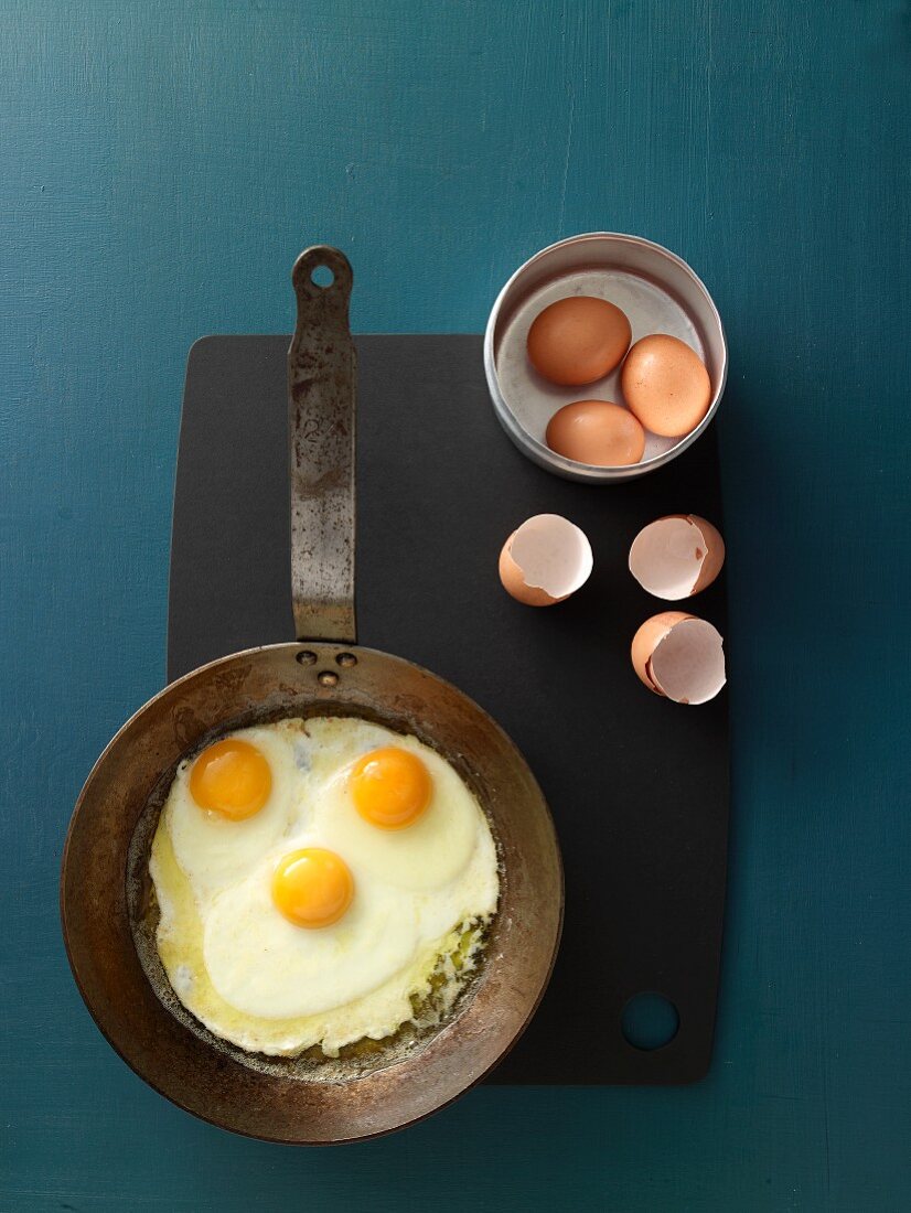 Fried eggs being made