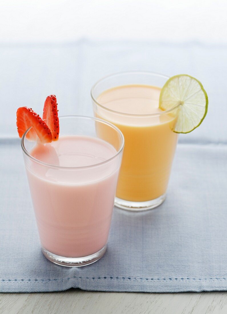 A strawberry milkshake and a mango lassi (mango yogurt drink)