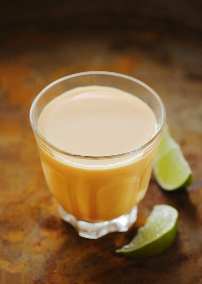 A glass of mango lassi (mango yogurt drink)