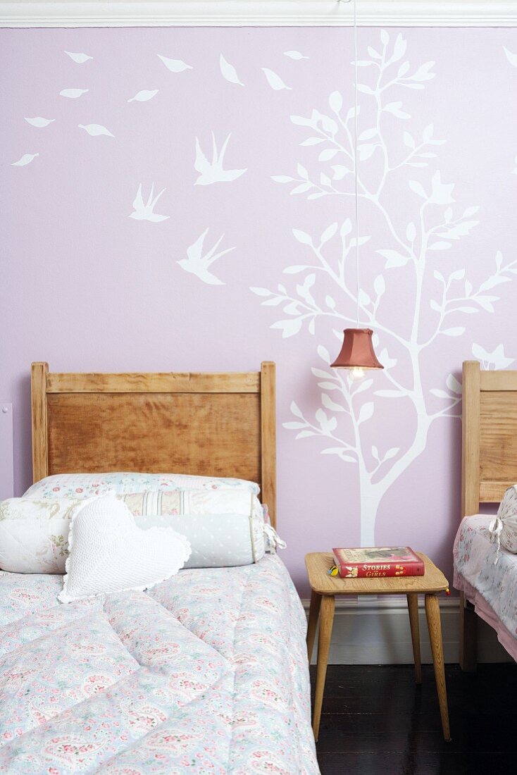 Girl's room with wall stickers on pink wall