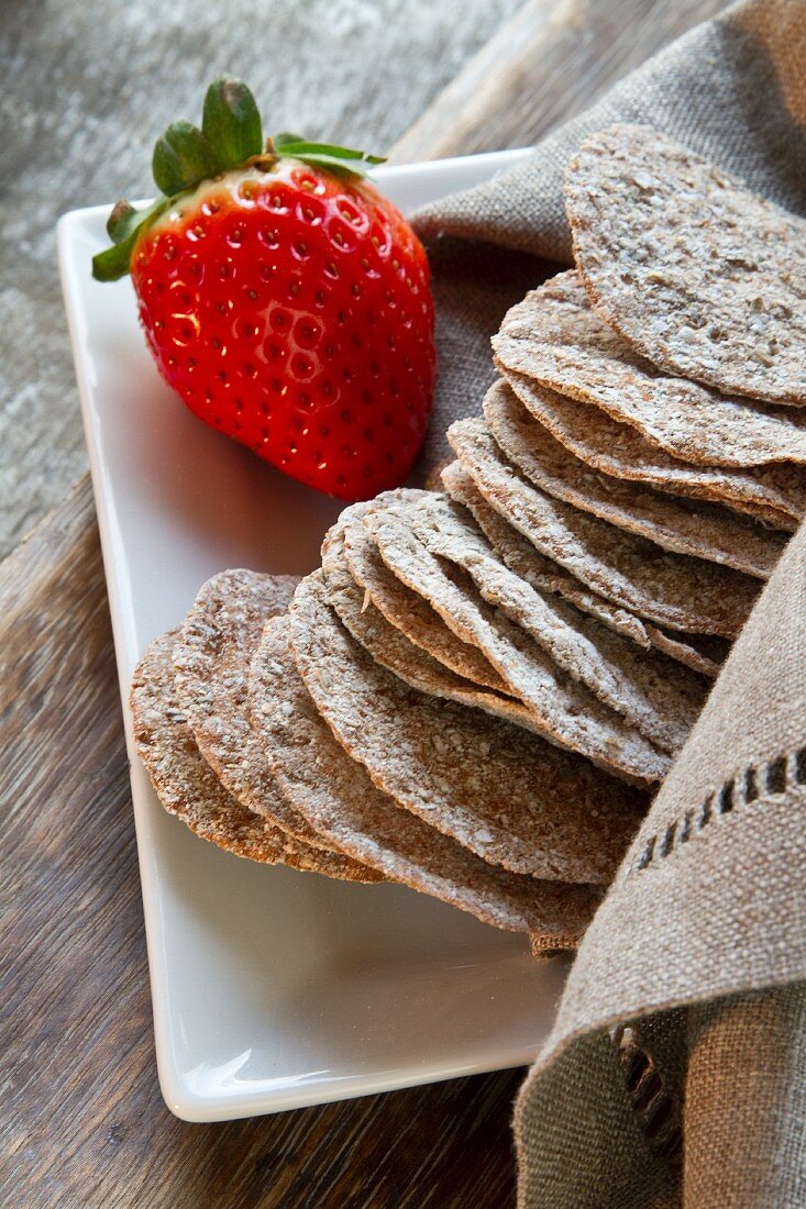 Schüttelbrot (crispy unleavened bread from South Tyrol) and a strawberry