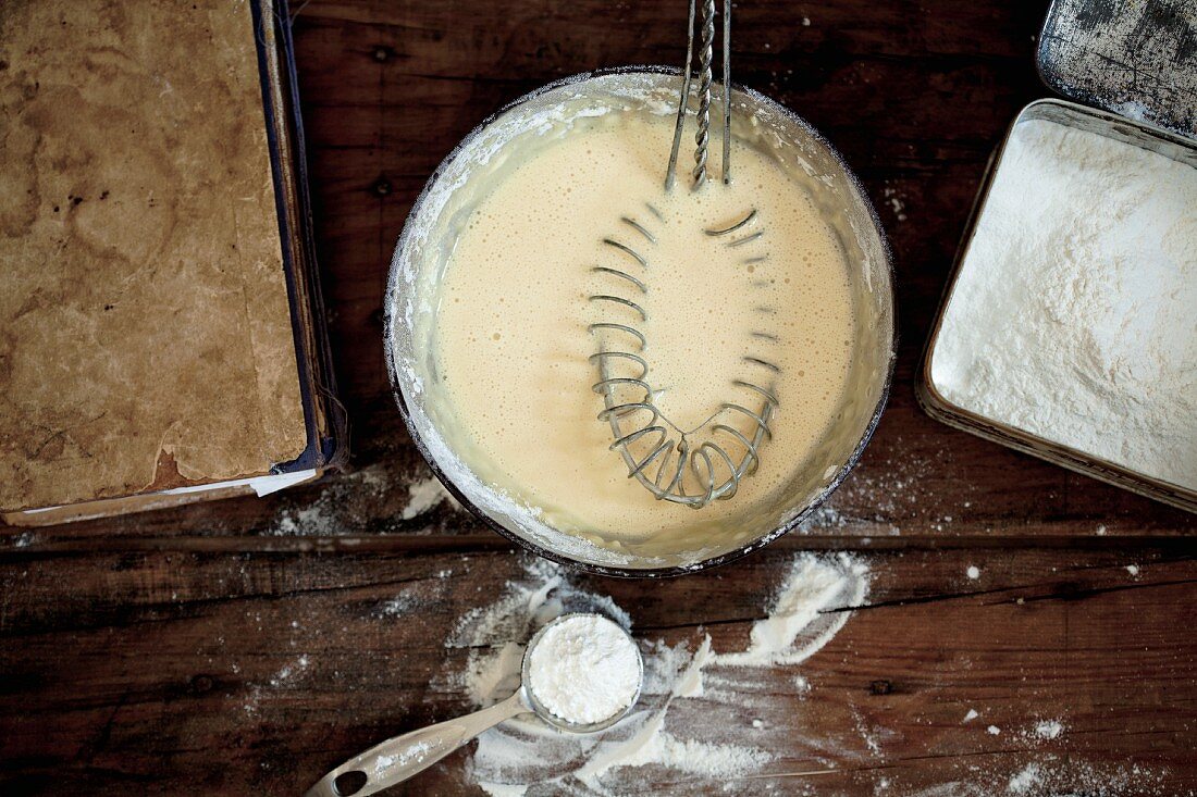 Batter, flour and baking tin