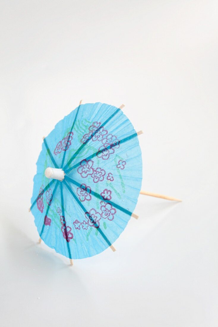 A blue cocktail umbrella