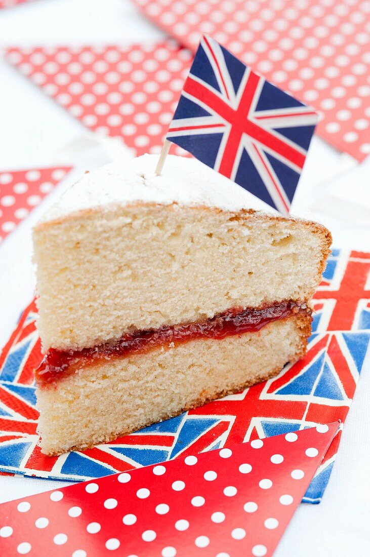 A slice of sponge cake decorated with a Union Jack