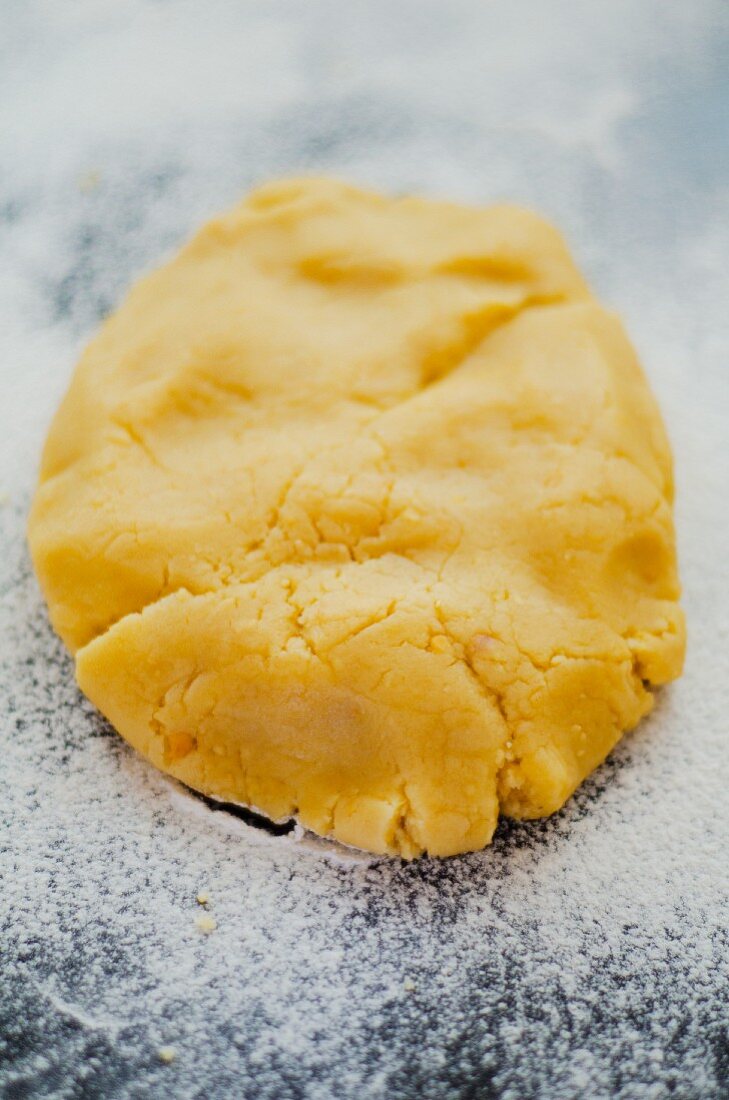 Cookie dough on a floured work surface