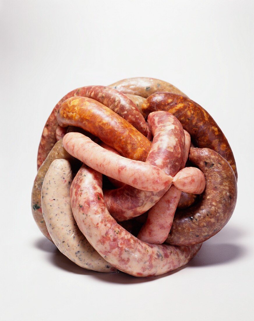 Variety of Sausages in a Ball; White Background