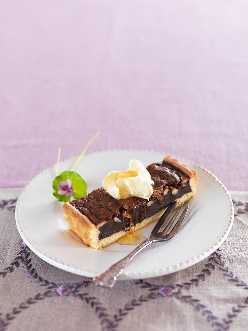 Chocolate and orange pine nut tart