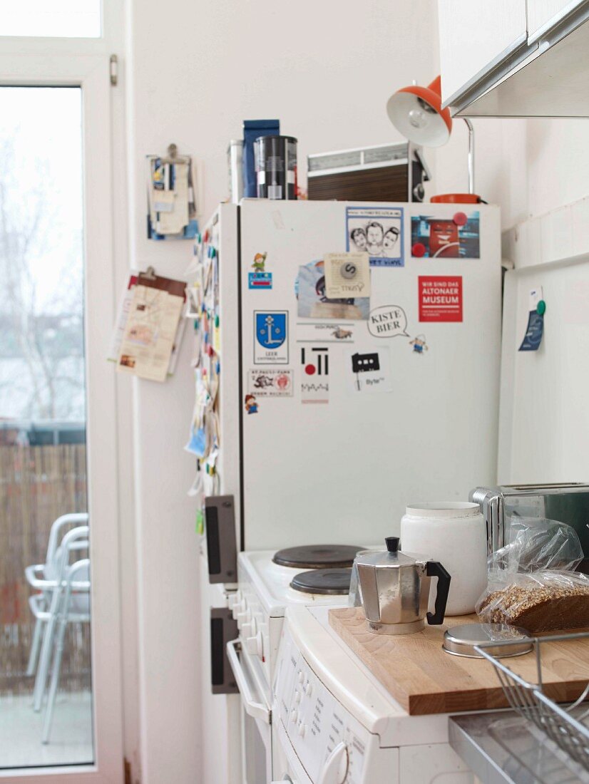 Detail of functional kitchen with stickers on fridge freezer