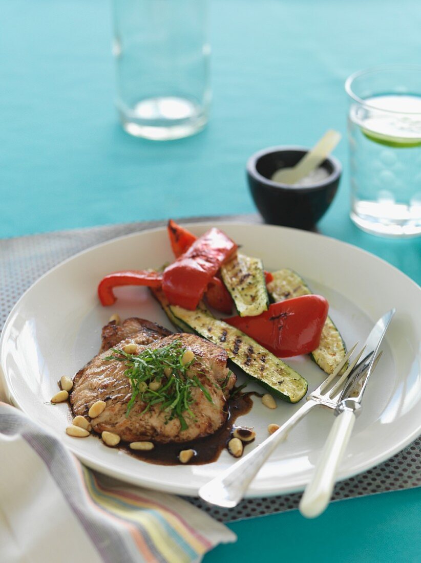Pork escalope with balsamic vinegar and pine nuts