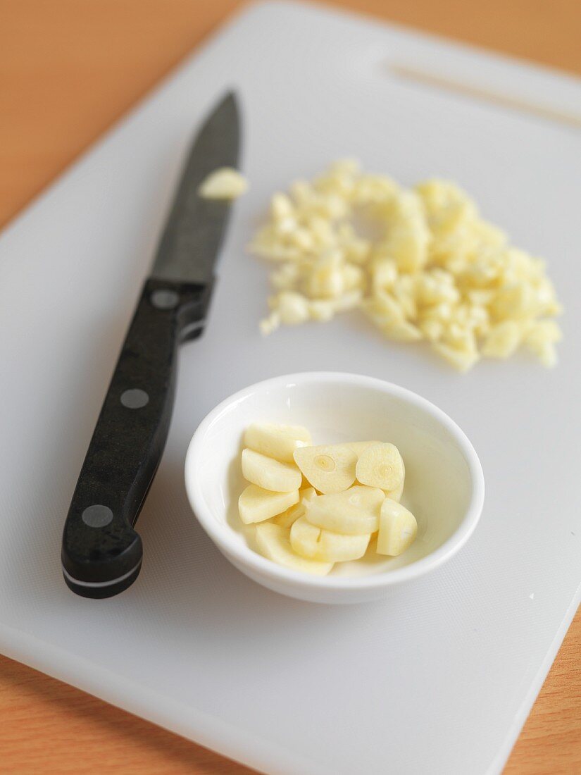Fresh garlic, sliced and chopped, with a knife