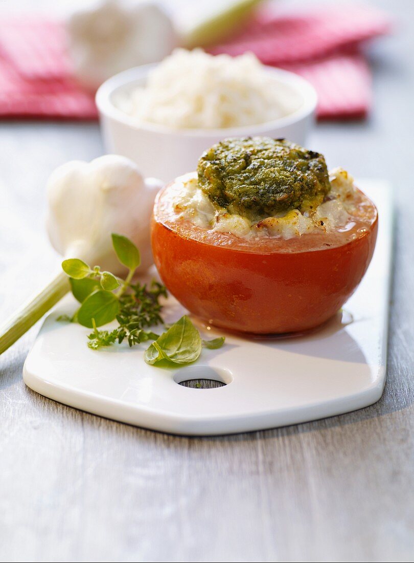 A stuffed tomato with a herb crust