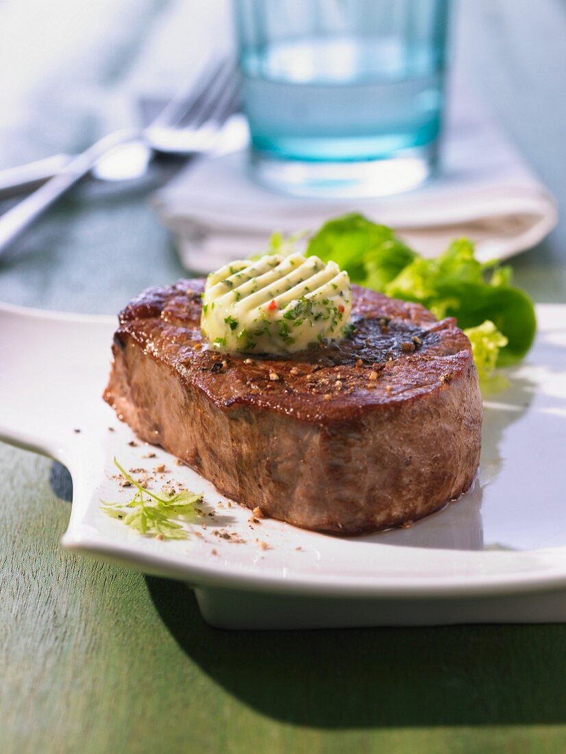 Beef loin steak with herb and garlic butter