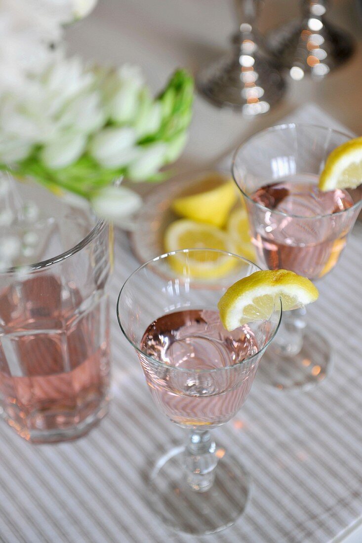 Aperitifs with ice and lemon wedges