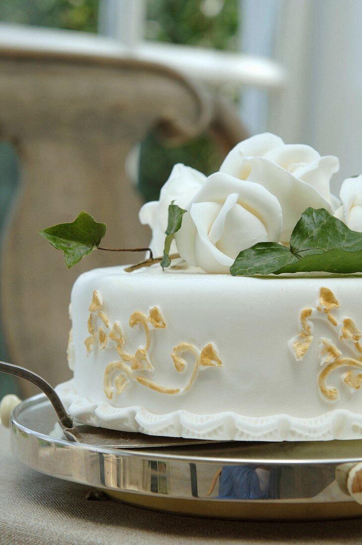 A celebratory cake decorated with roses