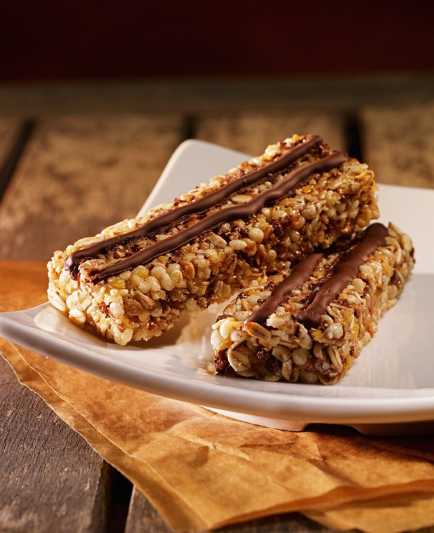 Two muesli bars with chocolate stripes