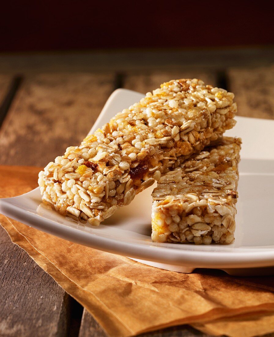 Two muesli bars on a white plate