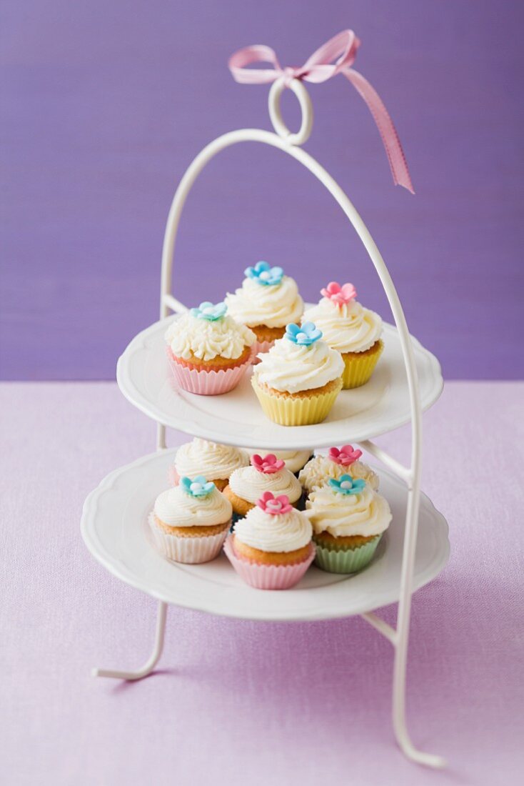 A selection of cupcakes on a cake stand