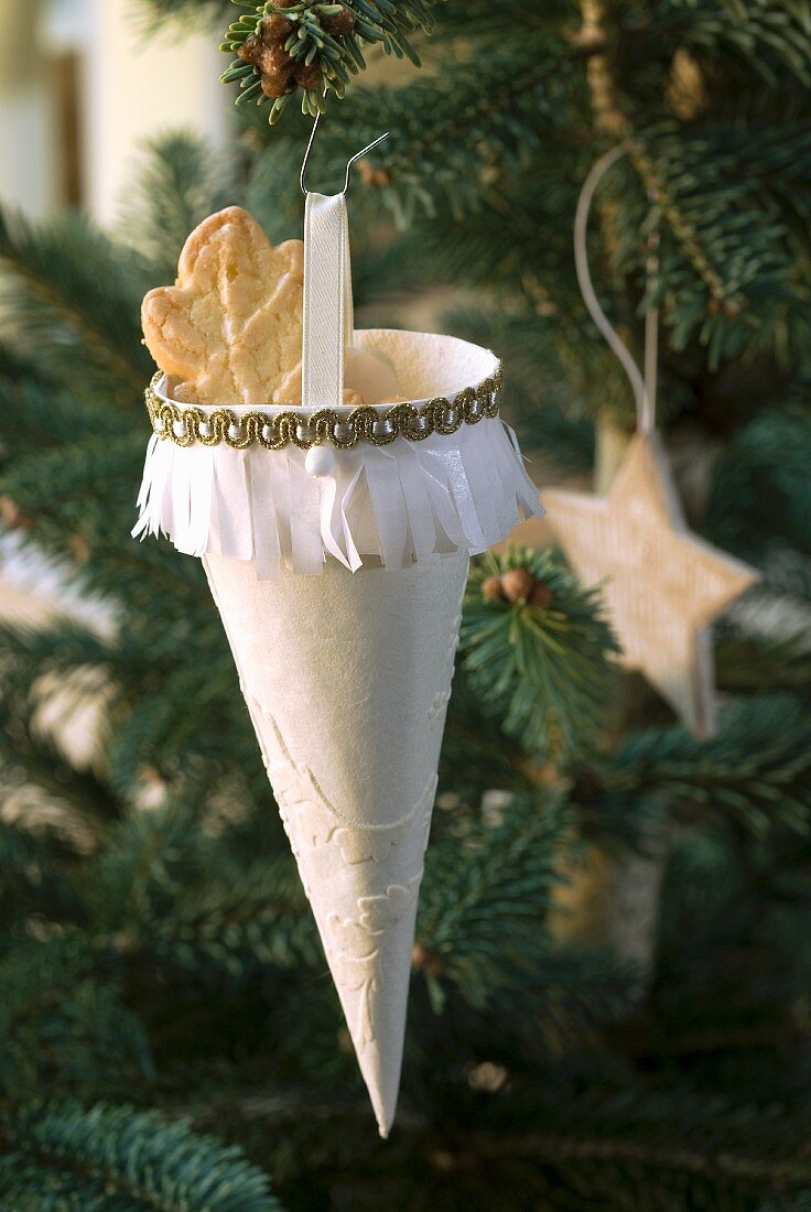 Hand-made paper cone as Christmas tree decoration