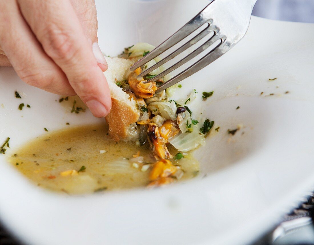 Soaking Up the Remains of Mussel Marinere with Bread