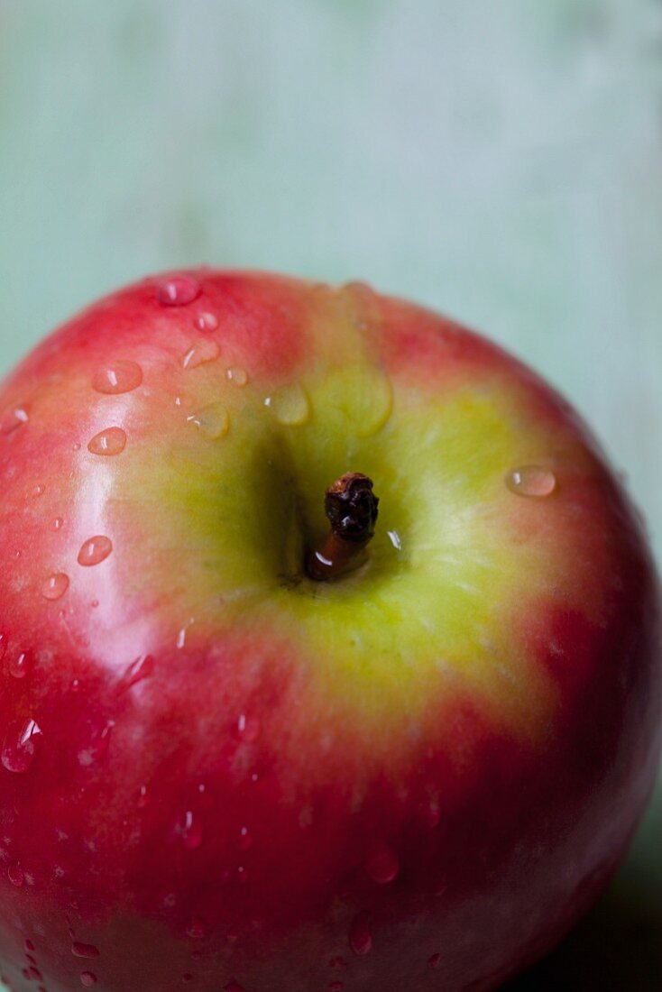 An apple with drops of water