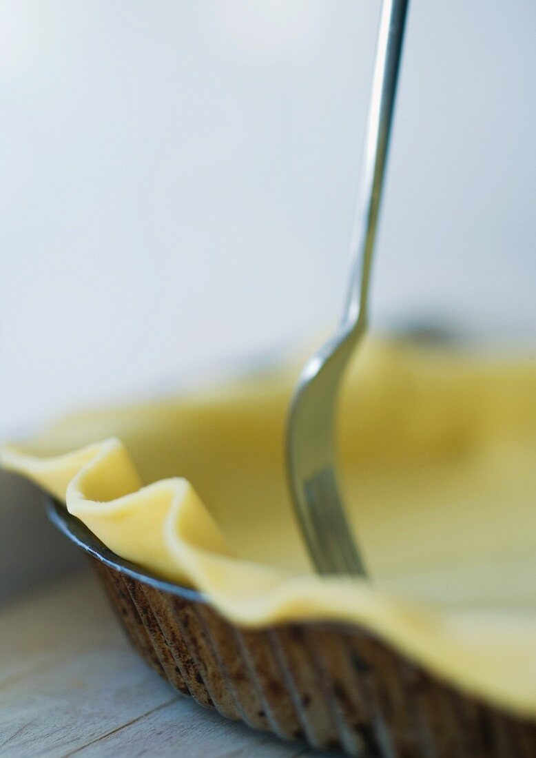 Fork and pie crust dough