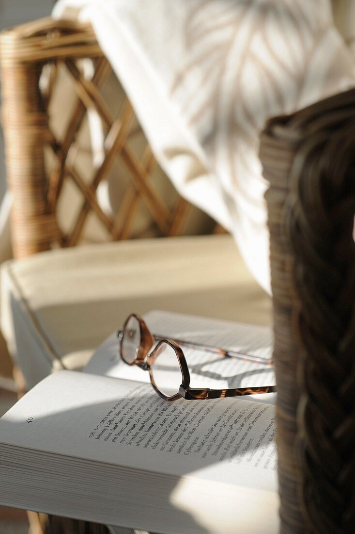 Glasses lying on book