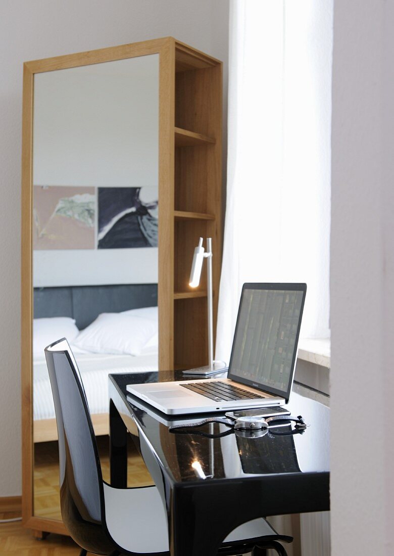 Desk with laptop at the window