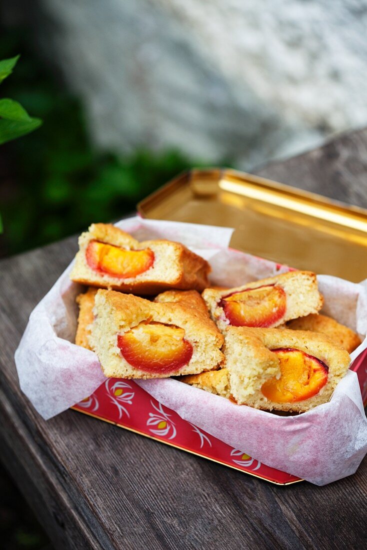 Nectarine slices in a picnic tin