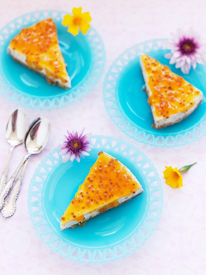 Three slice of cheesecake with passion fruit sauce