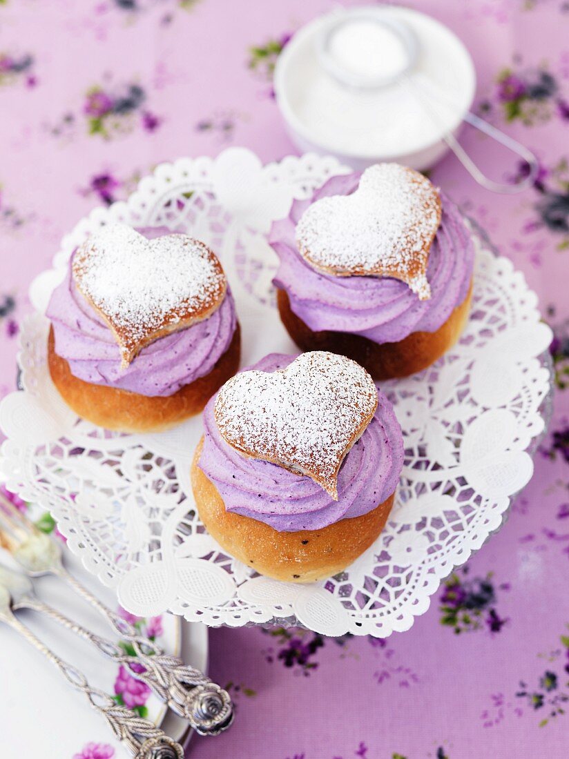 Profiteroles with blueberry cream and icing sugar