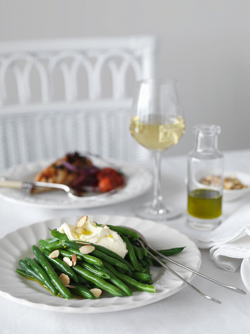 Green beans with feta cheese on a table