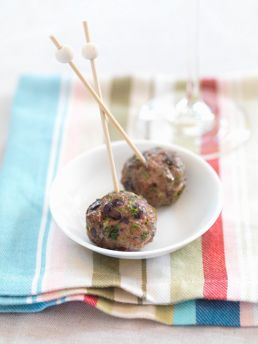 Meatballs with olives on sticks