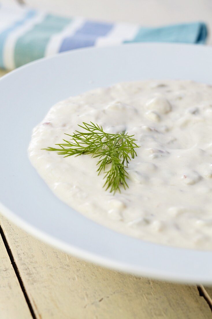 Bowl of Clam Chowder with Dill Garnish