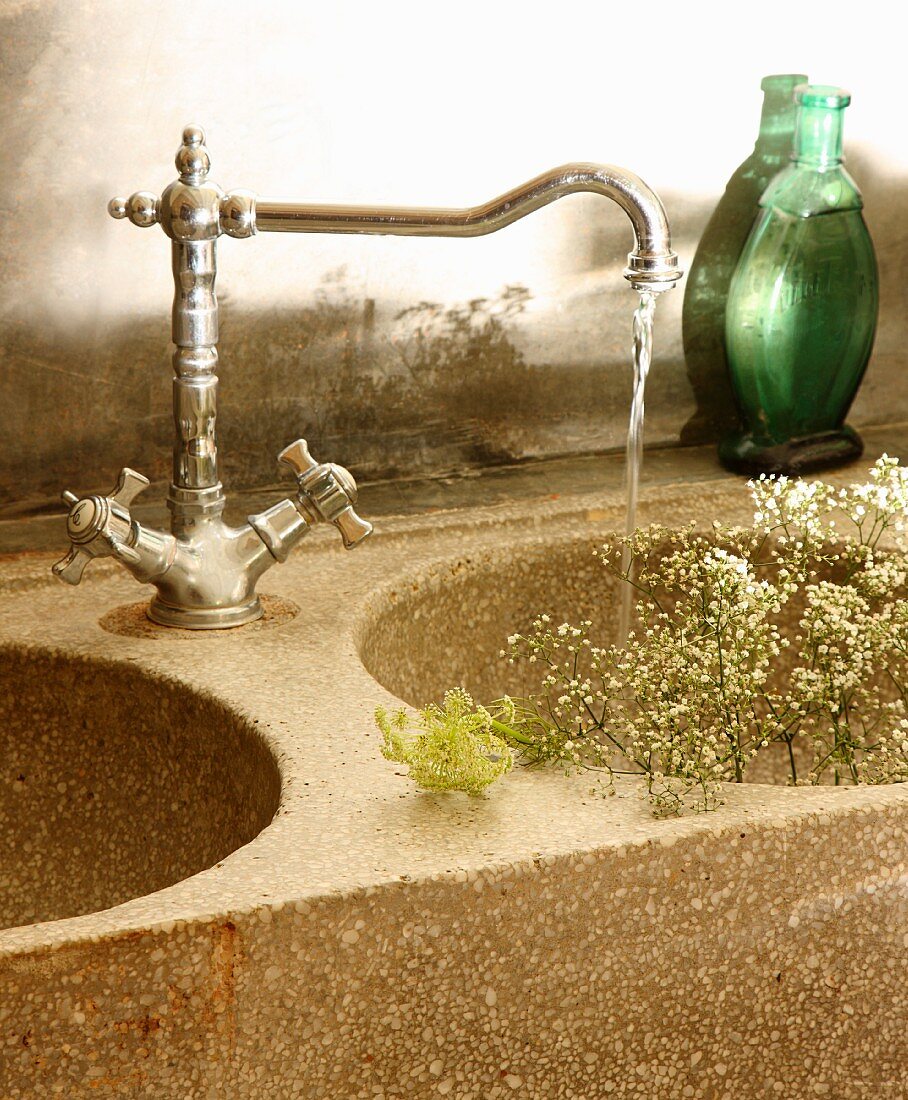 Gypsophila in stone sink of washstand with vintage tap