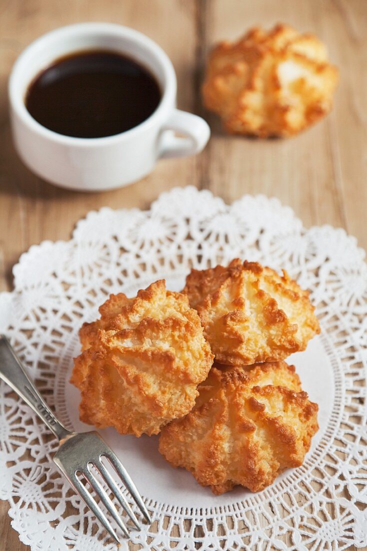 Coconut Macaroons on a Doily with a Cup of Coffee