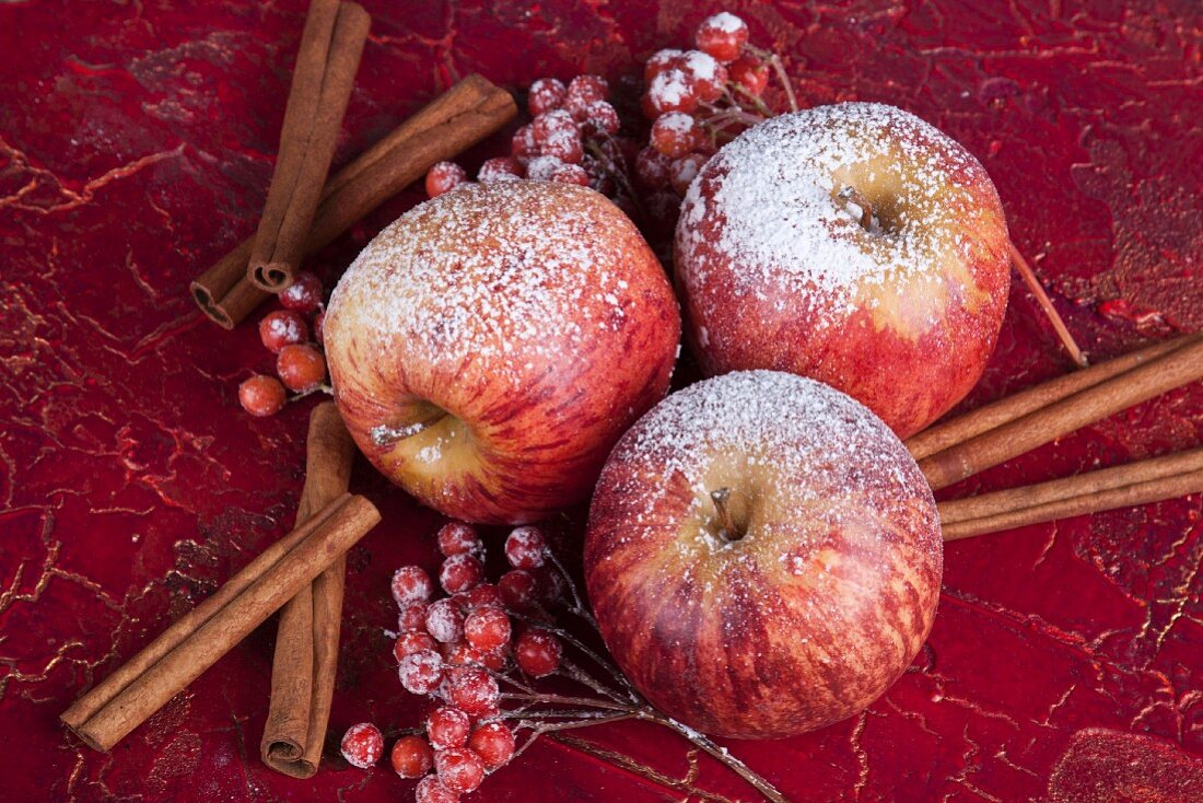 Christmas decorations with apples, berries and cinnamon sticks