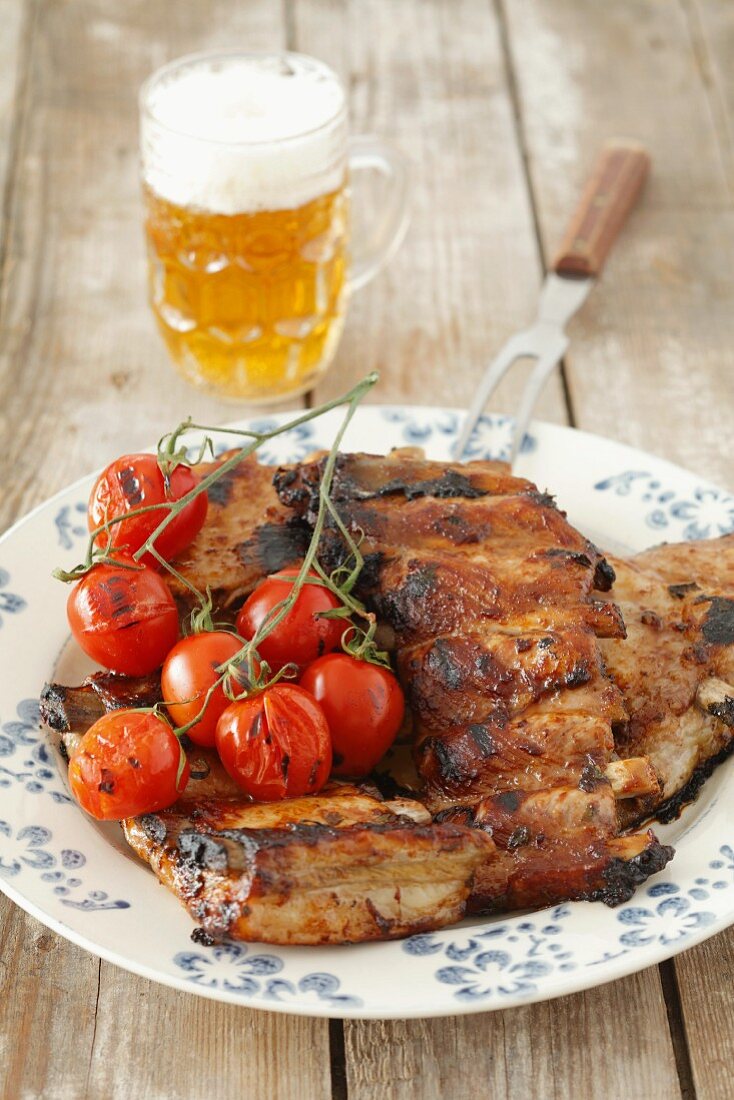 Grilled pork ribs with cocktail tomatoes