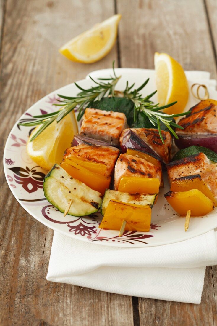 Grilled salmon and vegetables kebabs with rosemary