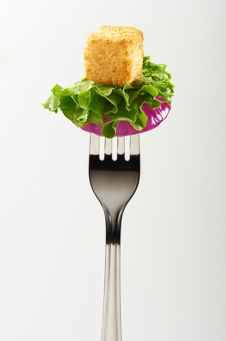Red Onion, Lettuce and Crouton Pierced on a Fork