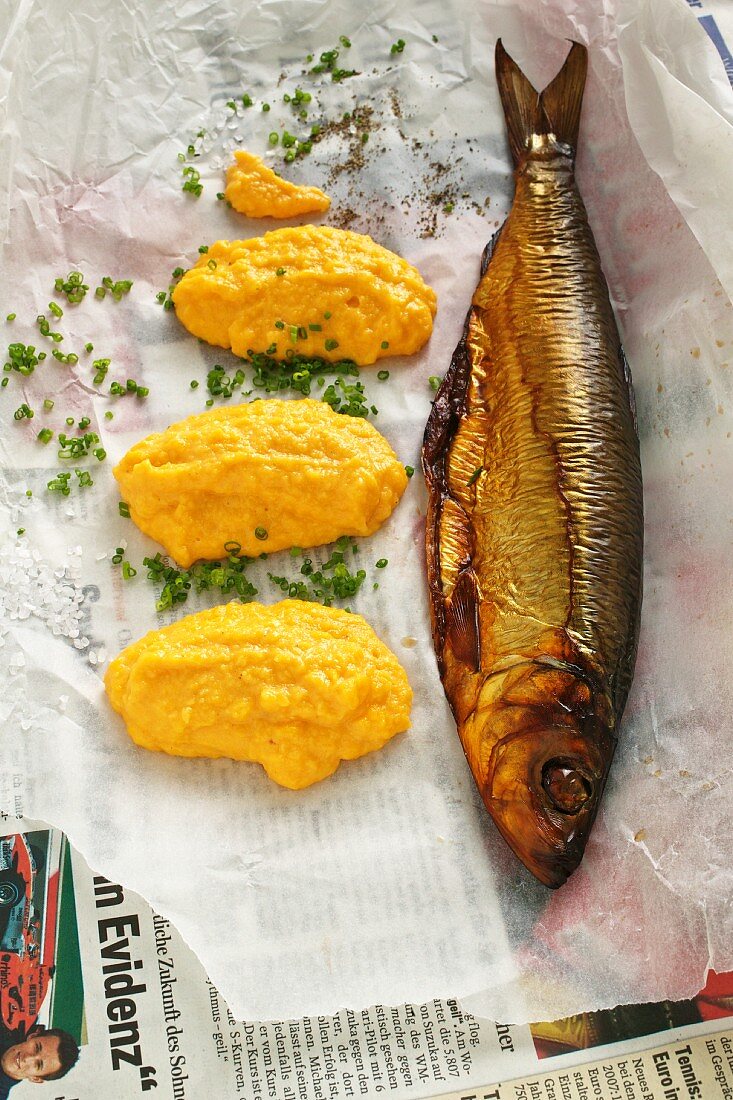 Kipper with scrambled egg on paper