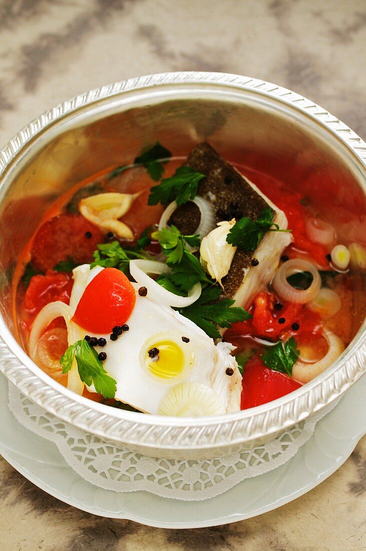 Steamed turbot in a tomato broth with quail's eggs