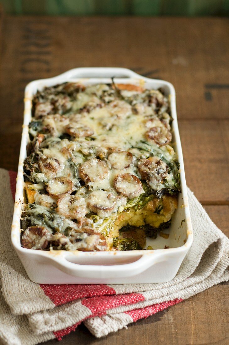 Sausage and Swiss Chard Strata in a Casserole Dish; Scoop Removed