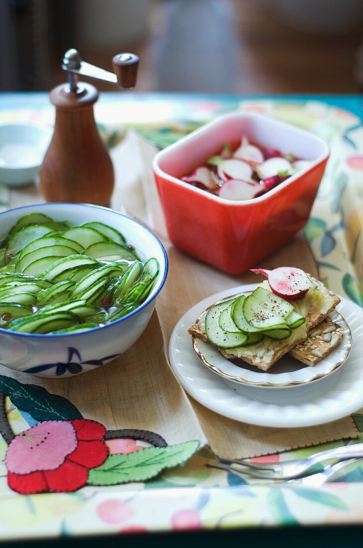 Thinly Sliced Pickled Cucumbers and Pickles Radishes; Both Pickles on Buttered Crackers