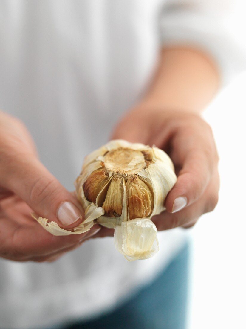 Garlic being peeled