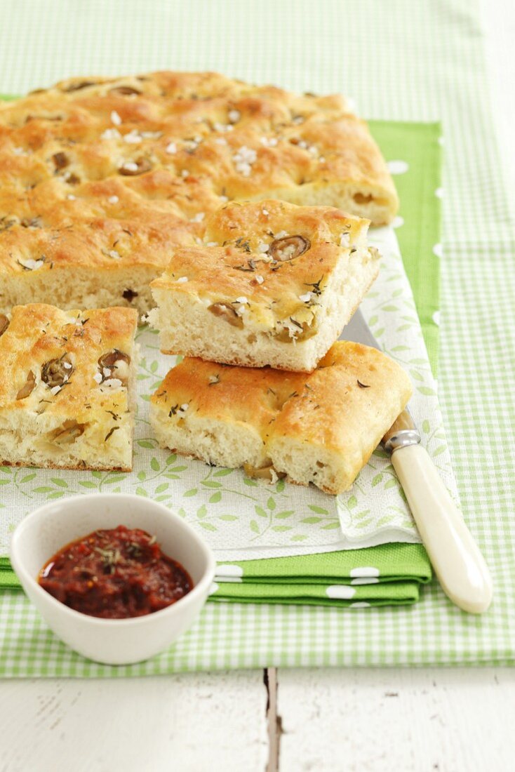 Focaccia with olives, thyme and sea salt and a dried tomato dip